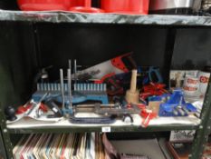 A quantity of woodworking hand tools including saws, chisels,