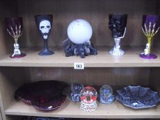 Two shelves of Halloween goblets,