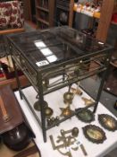 A glass topped metal table