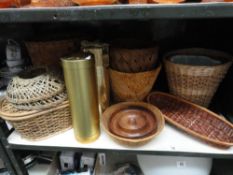 A shelf of basketware and treen