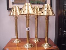 4 brass candlesticks with shades