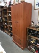 A wardrobe with 2 drawers at base