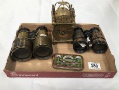 A small brass lantern clock and two pairs of vintage binoculars etc