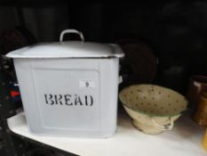 An enamel bread bin, colander,