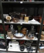 Three shelves of kitchenware including Pyrex