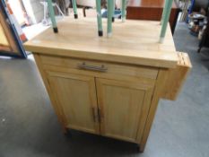 A pine butchers block style cupboard