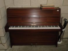 A Chappell upright piano and music scores / books