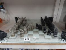 A Vampire and Werewolf chess set and board