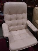 A 1970s leather swivel chair