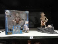 A boxed Gollum toy and one other Gollum toy