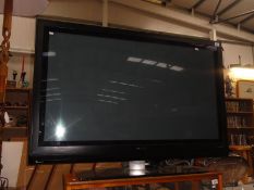 A Philips 50PFP5532D 50" 1080i HD Plasma Television with remote control and instructions