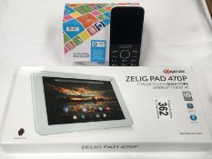 A new Zelia Pad 470P Internet tablet and a Alcaltel One Touch mobile phone in box