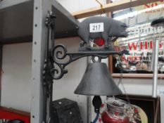 A cast iron bell / garden bell with pig feature