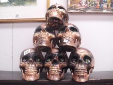 A multi-skull display with movable jaws