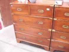 A 2 over 3 campaign chest of drawers