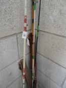 A collection of fishing rods including vintage