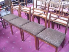 A set of 4 retro dining chairs with upholstered seats