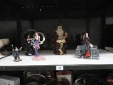 A collection of Wizard figurines and other figurines