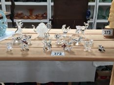 A quantity of crystal glass figures including Swarovki