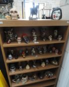 A large quantity of miniature skulls and other figurines