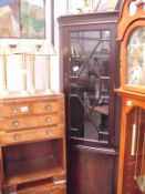 A mahogany effect corner cabinet