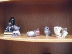 A collection of Poole stoneware animals and other animal figures