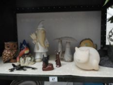 A collection of animal figurines and pottery items