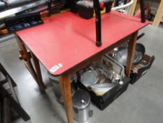 A vintage red topped kitchen table