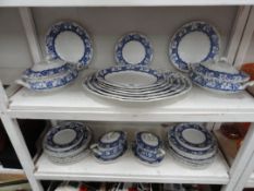 An early Doulton Burslem blue and white dinner set including 4 tureens and 6 graduated platters
