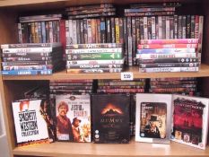 A collection of DVDs - 2 shelves