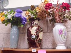 3 vases with dried flower arrangements