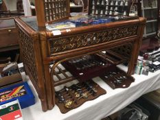 A wood and weave glass topped coffee table