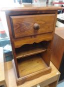 A small pine cabinet with drawer
