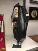 A Limited Edition Vixen of the Underworld doll in a coffin box