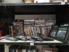 A collection of approximately 100 DVDs