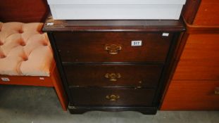 A dark wood stained 3 drawer chest