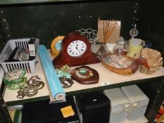 A shelf of miscellaneous including horse brasses & clock etc.