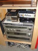 A mixed lot including a Toshiba stereo sound system, cassettes & TV box sets etc.