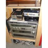 A mixed lot including a Toshiba stereo sound system, cassettes & TV box sets etc.