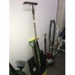 A quantity of garden tools including rake & spade etc.