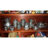 A box of pewter items including tankards & teapots etc.