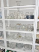 4 shelves of good drinking glasses & cake stands etc.