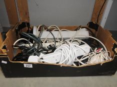A box of electrical extension leads etc.