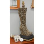 A leopard print boot table lamp