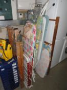 A quantity of ironing boards & clothes airers etc.