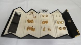 9 pairs assorted earrings in carry case.