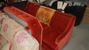 A red 3 seater sofa with large foot rest