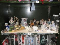 A shelf of figures including Capo-di-Monte style figures
