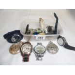 A box of watches including Tissot, TAG heuer etc.