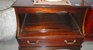 A dark wood stained TV cabinet